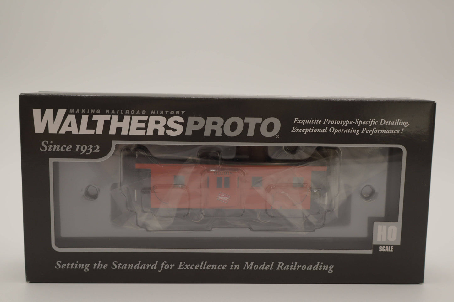 Walthers HO 920-103653 - Proto - Rib Sided Caboose "Milwaukee Road" #991918 (Orange, Black, Yellow; Includes Oil Stove)