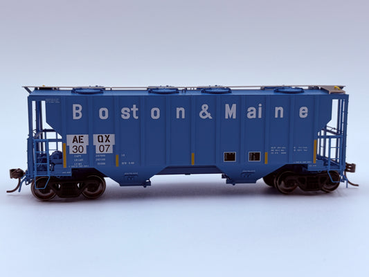 Model of a blue Boston & Maine train car on a white background