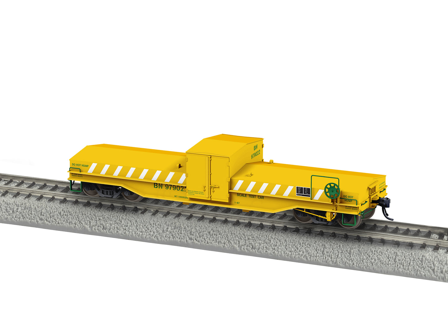 Yellow model train car on a track with a white background
