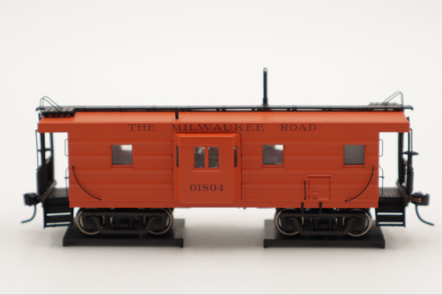 Walthers HO 920-103652 - Proto -  Rib Sided Caboose "Milwaukee Road" #01870 (Orange, Maroon; Includes Coal Stove)