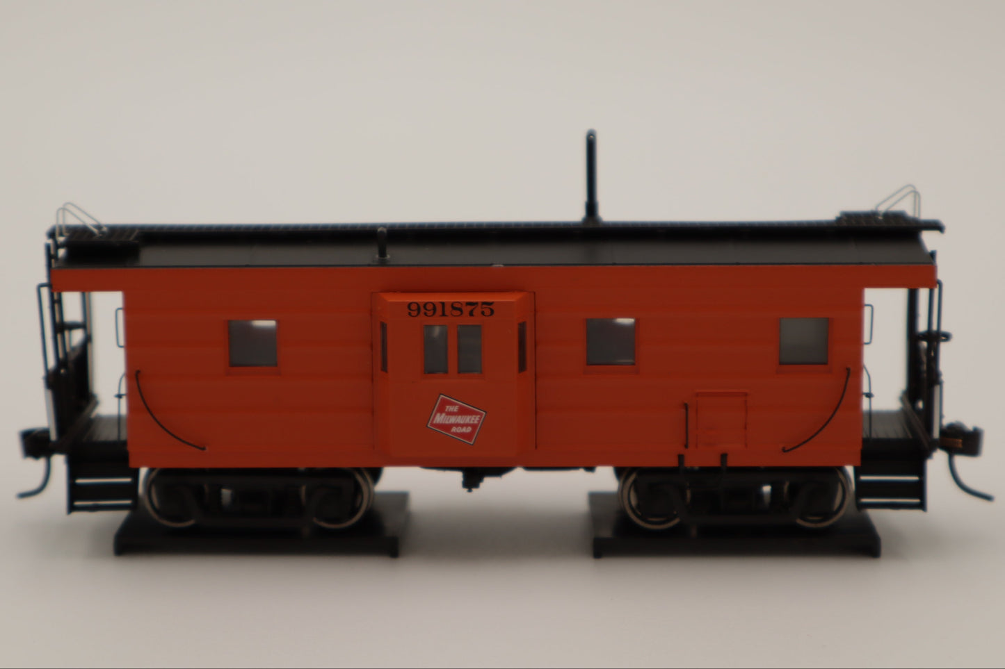 Walthers HO 920-103656 - Proto -  Rib Sided Caboose "Milwaukee Road" #991898 (Orange, Black; Includes Oil Stove)