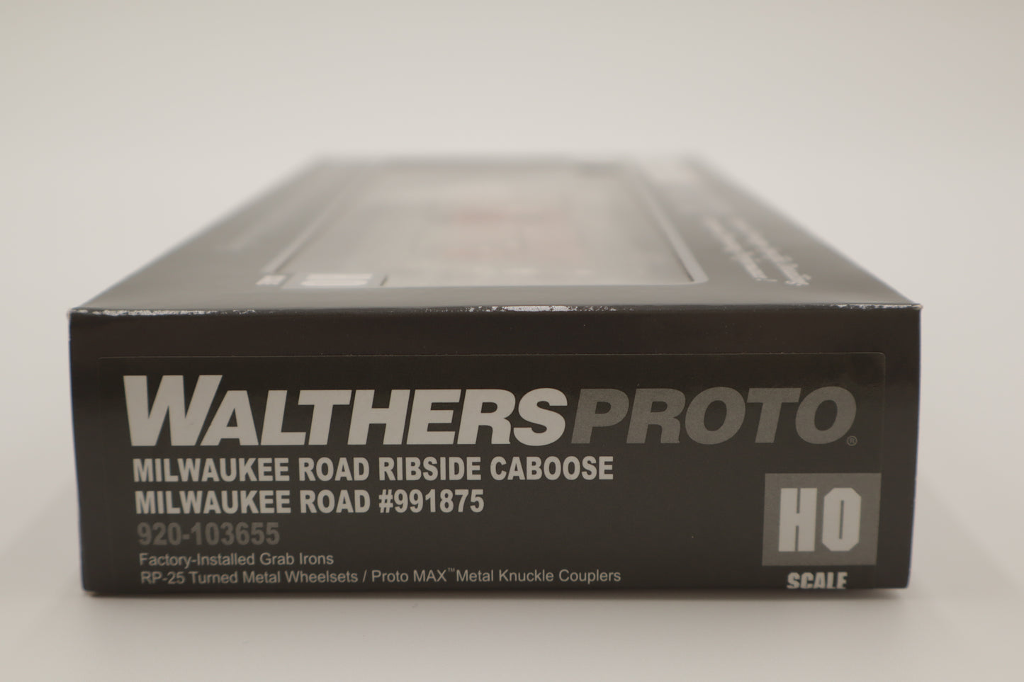 Walthers HO 920-103655 - Proto -  Rib Sided Caboose "Milwaukee Road" #991875 (Orange, Black; Includes Oil Stove)