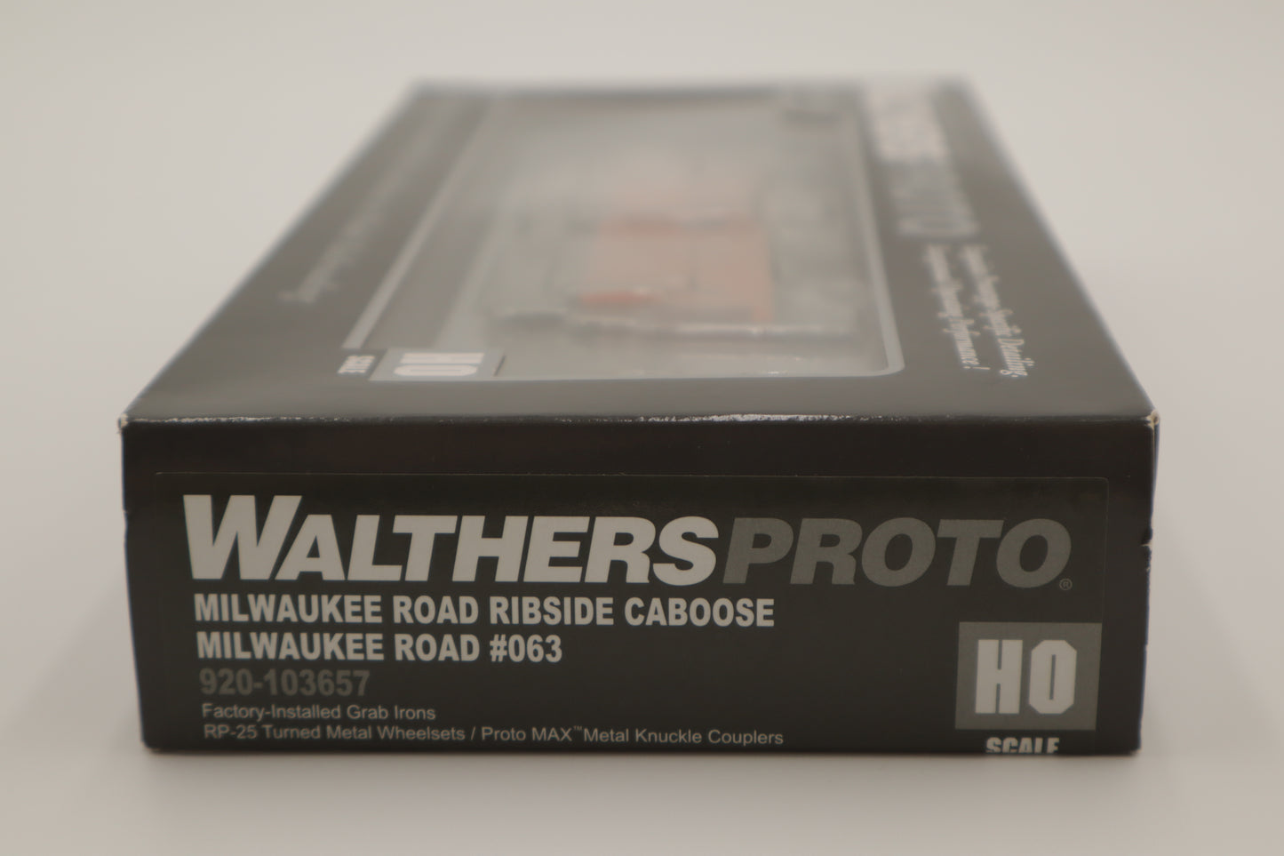 Walthers HO 920-103657 - Proto -  Rib Sided Caboose "Milwaukee Road" #063 (Orange, Black; Includes Oil Stove)